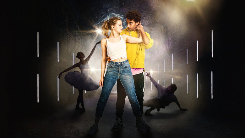 Katya and Marlon mid-dance, their bodies angled toward each other in a Hamburg alleyway, the city’s industrial backdrop blurring into motion