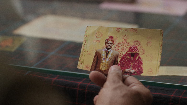 A crowded train station in rural India, where the two brides, veiled and uncertain, prepare to disembark into separate fates.