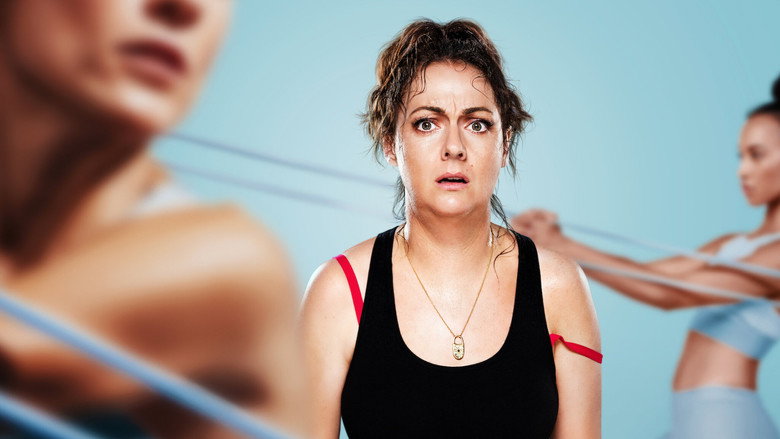 Liv Healy mid-pratfall, green juice splashing everywhere, surrounded by yoga mats and crystals