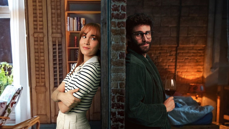 Aitana as Valentina, seated at her piano, her fingers hovering over the keys as she glances toward the wall separating her from David
