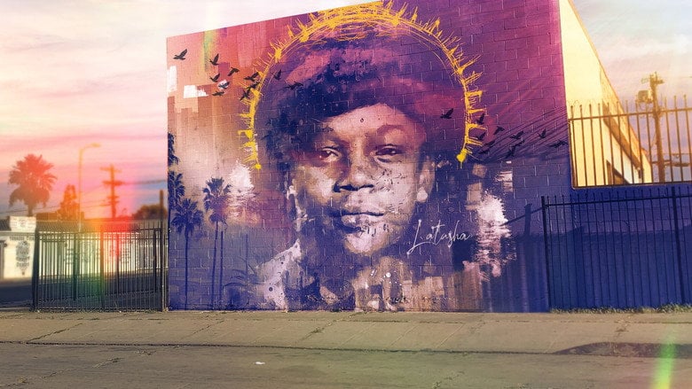 A blurred, golden-hued shot of a young Black girl's face, her features softened by light, as if seen through memory.