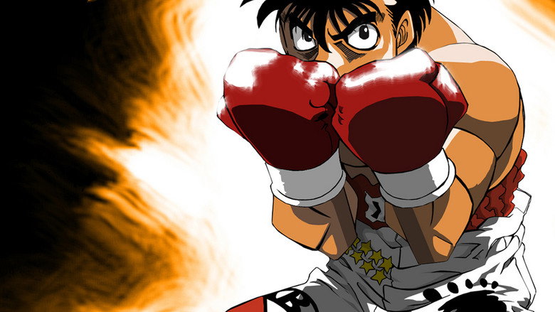 Ippo mid-spar, gloves raised, sweat flying in slow motion