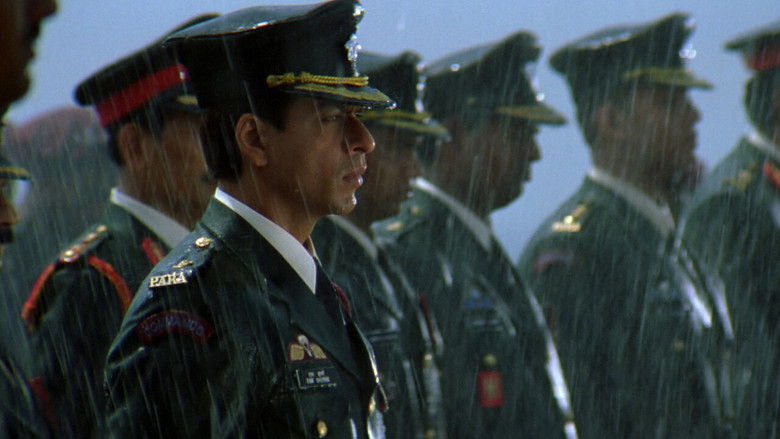 A chaotic college hallway, students in uniform laughing as Shah Rukh Khan’s character, in military fatigues, tries to blend in while looking utterly out of place