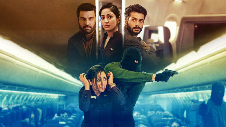 A tense moment in the airplane cabin, where Neha (Yami Gautam) and Ankit (Sunny Kaushal) exchange a loaded glance, their faces half-lit by the dim overhead lights.