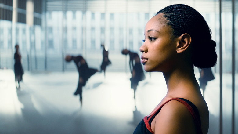 A dimly lit ballet studio, mirrors reflecting the tension between two dancers mid-rehearsal