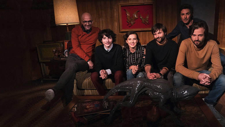 The cast of *Beyond Stranger Things* gathered around a table, laughing as Jim Rash gestures mid-conversation
