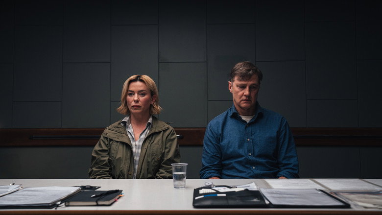 A close-up shot of a detective looking weary and contemplative in a sterile, modern office