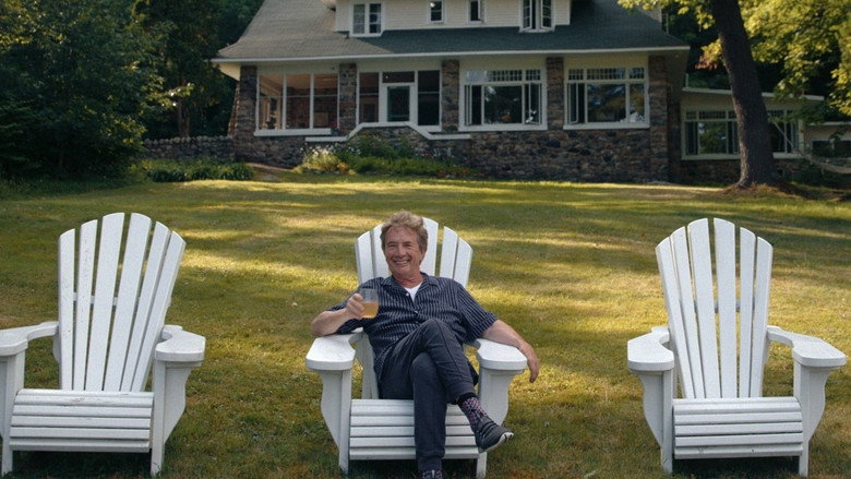 Martin Short mid-laugh, surrounded by friends at a backyard gathering, sunlight filtering through trees