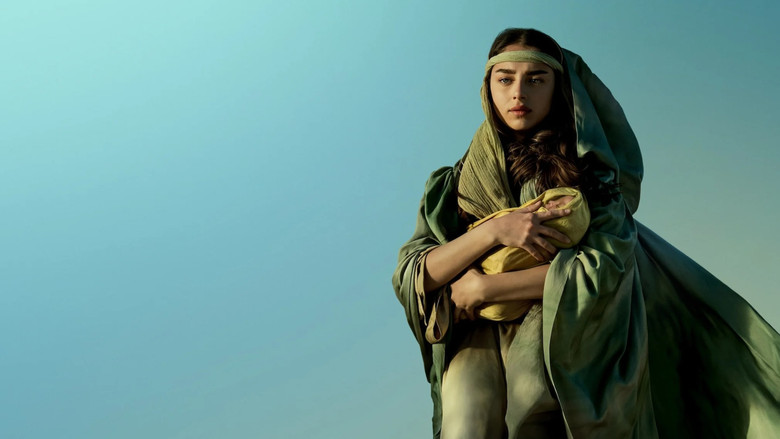 Mary stands in a sunlit doorway, her face half in shadow, as if caught between two worlds