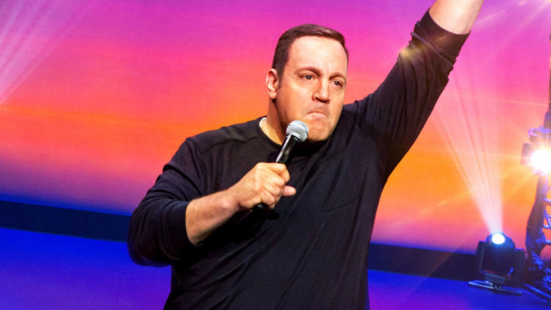 Kevin James mid-performance, gesturing with his hands as he delivers a punchline