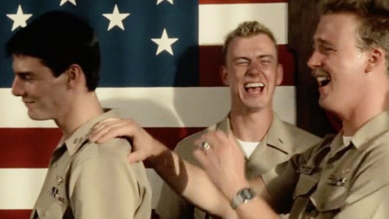 Pilots standing on the tarmac as the sun dips below the horizon