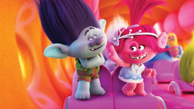 A cluster of Trolls gathered around a glowing, oversized holiday ornament, their neon hair and glittering outfits reflecting the warm light.