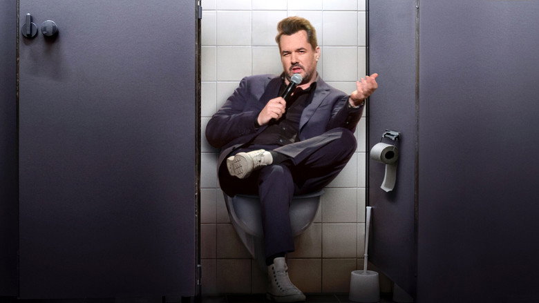 Jim Jefferies mid-rant, arms outstretched, sweat glistening under stage lights