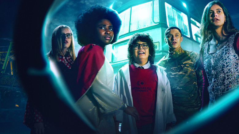 A group of schoolchildren huddle together in a dimly lit bus, their faces illuminated by the glow of an unseen threat outside.