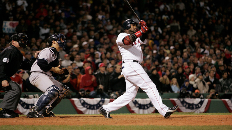 Pedro Martínez mid-windup, Fenway Park bathed in golden-hour light, the weight of the moment etched into his face