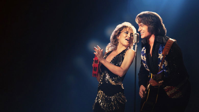 Mike and Claire performing under stage lights