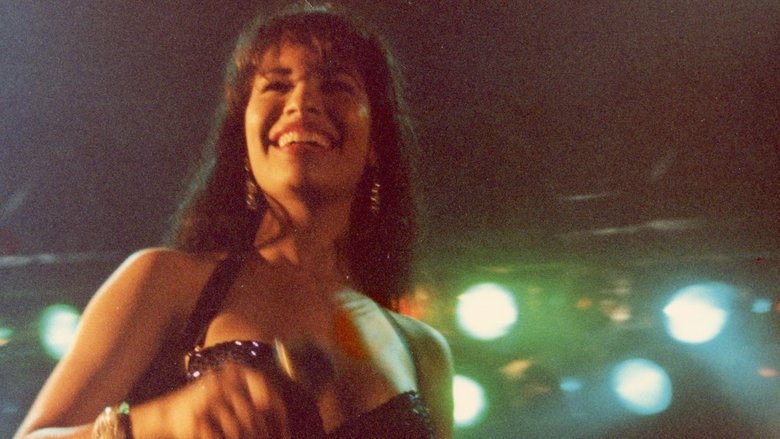 Selena and her siblings performing in a dimly lit restaurant, their faces lit by the glow of a single spotlight