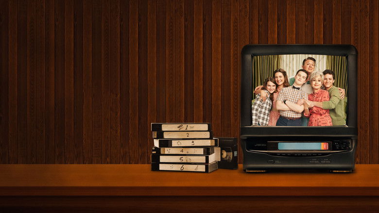The Cooper family sitting around the dinner table