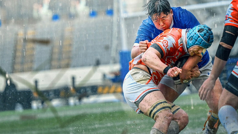 A scrum collapses into a tangle of limbs, the players' faces twisted in effort as the camera captures the raw, unfiltered chaos of the sport.