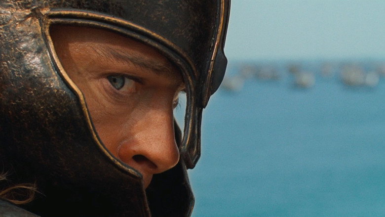 The massive walls of Troy under siege by the Greek forces