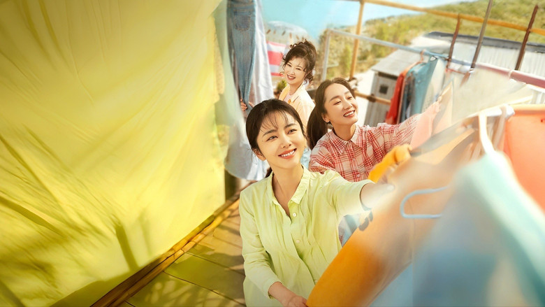Wanzhi and her friend sharing a tense, quiet moment on a cramped urban balcony