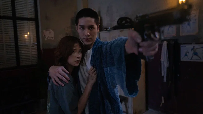 A knife fight in a dimly lit room, blood spraying in slow motion as two figures grapple in close combat.