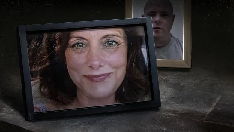 A dimly lit room, the glow of a television casting long shadows on a wall of family photos.
