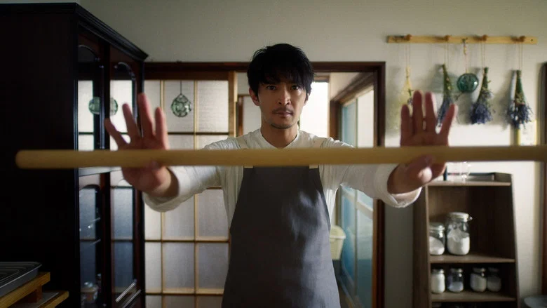 A former yakuza meticulously arranges a bento box with the precision of a tactical operation