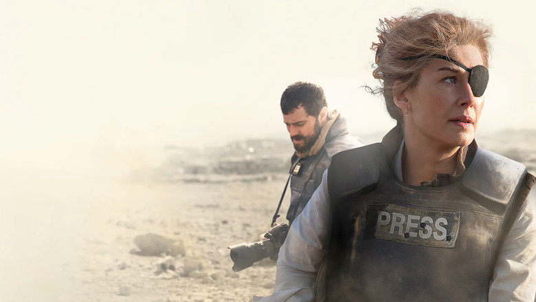 Marie Colvin, her face half in shadow, the eye patch stark against her skin, gazing intently at something beyond the frame.