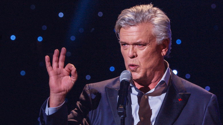 Ron White on stage, cigar in hand, mid-joke