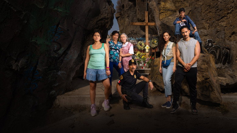 A dimly lit alley in Iztapalapa, where the three friends stand in a tense standoff, their faces half-lit by a flickering streetlamp.
