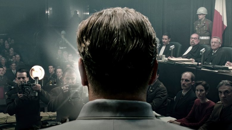 Hermann Göring and Douglas Kelley facing off in a prison cell