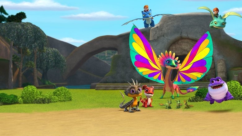 A group of young riders and their dragons stand in a lush, sunlit valley, gazing up at a shimmering, iridescent dragon perched on a cliff.