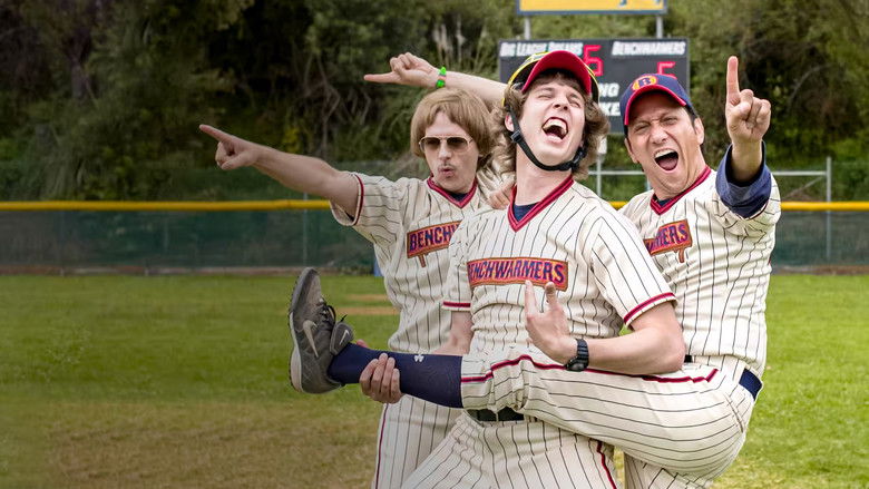 Three grown men in ill-fitting baseball uniforms stand awkwardly on a field, their postures slumped with a mix of determination and dread.