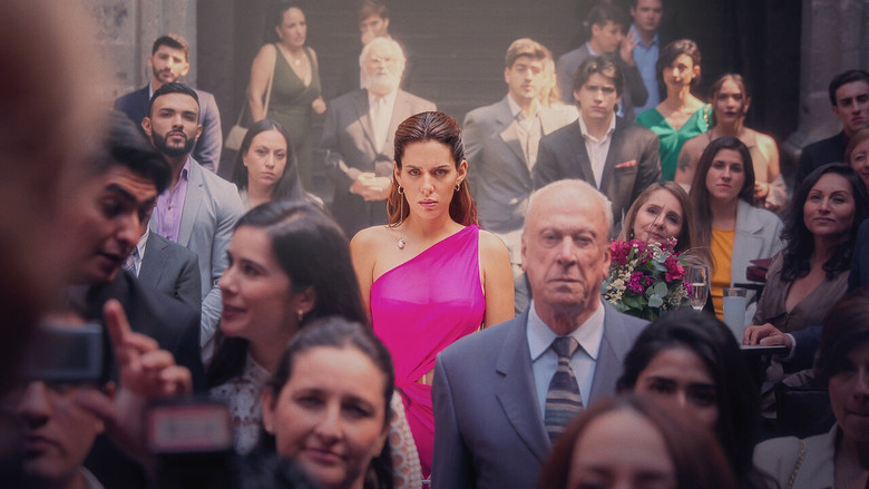 A tense confrontation in a dimly lit room, where Brenda Rey stands over one of the four women, her expression a mix of accusation and sorrow.