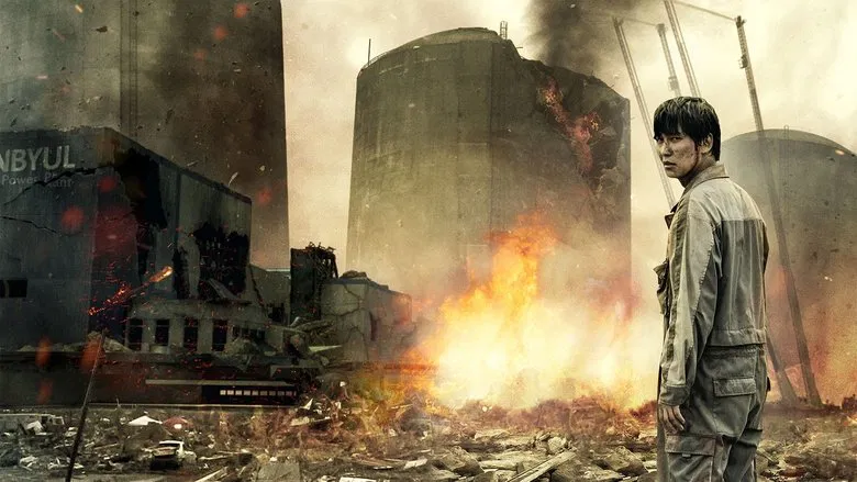 A small Korean town with a nuclear power plant looming in the background, its smokestacks dwarfing the houses below.