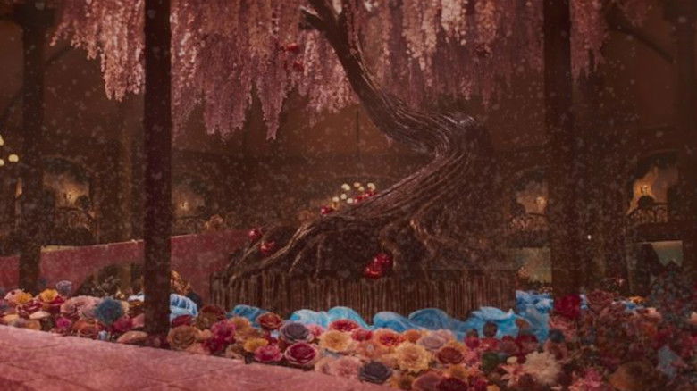 A brightly lit, magical candy shop interior filled with elaborate contraptions