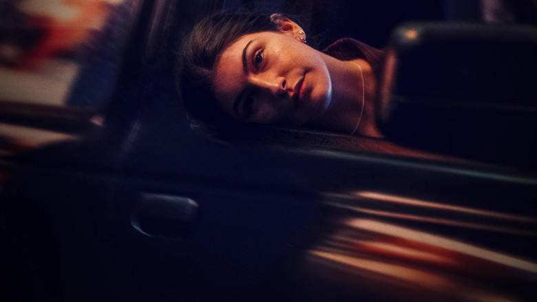 Sophie mid-song, her face lit by stage lights, the weight of the moment pressing against her smile