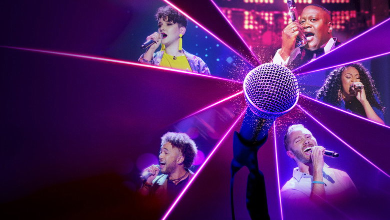 A contestant mid-performance, microphone in hand, eyes closed in concentration as the vocal analyzer’s score hovers on screen