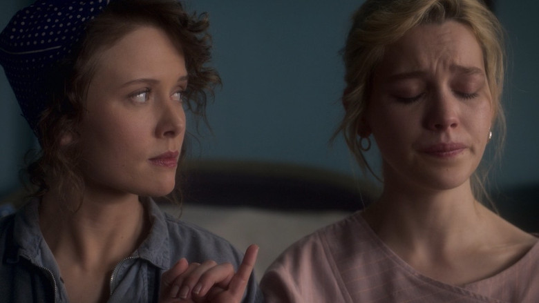 Hannah Grose standing in the hallway, looking lost in time