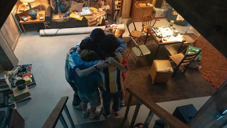 A camera operator framing a shot on the set of the Upside Down
