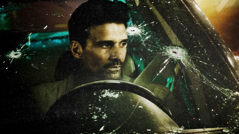 A tense moment inside the car, the driver's face half-lit by the glow of a cell phone screen