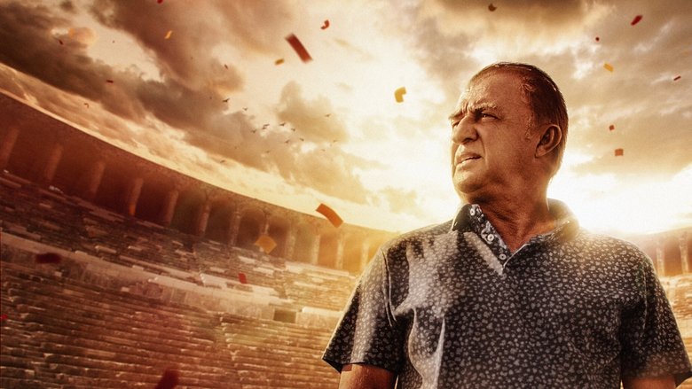 A close-up of Fatih Terim’s hands, weathered but still, resting on a table as he speaks.