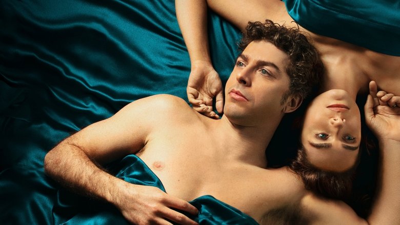 A couple embraces in a sunlit, empty apartment, their bodies half-dressed and entwined